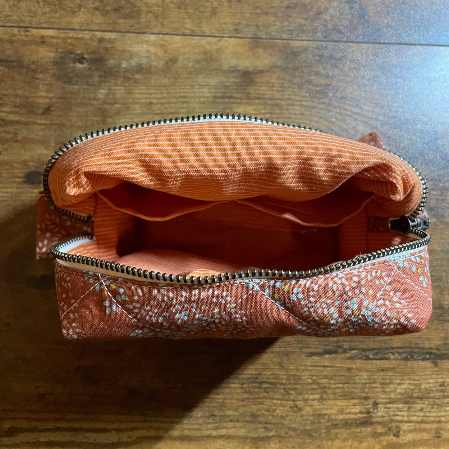 Handmade Quilted Makeup Pouch – Burnt Orange Leaf Print Bag