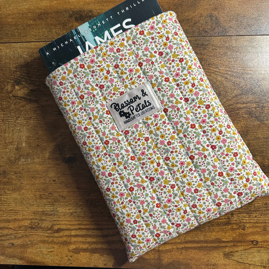 Handmade small floral padded fabric book sleeve protecting books and journals
