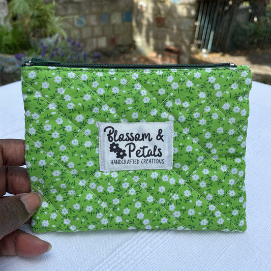 Green floral fabric with a visible brand label on a white surface