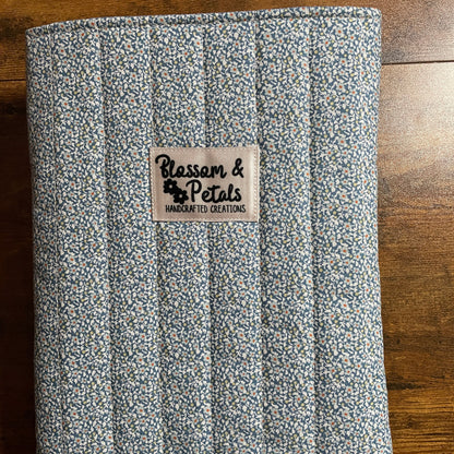 Handmade blue floral quilted fabric book sleeve with padded protection