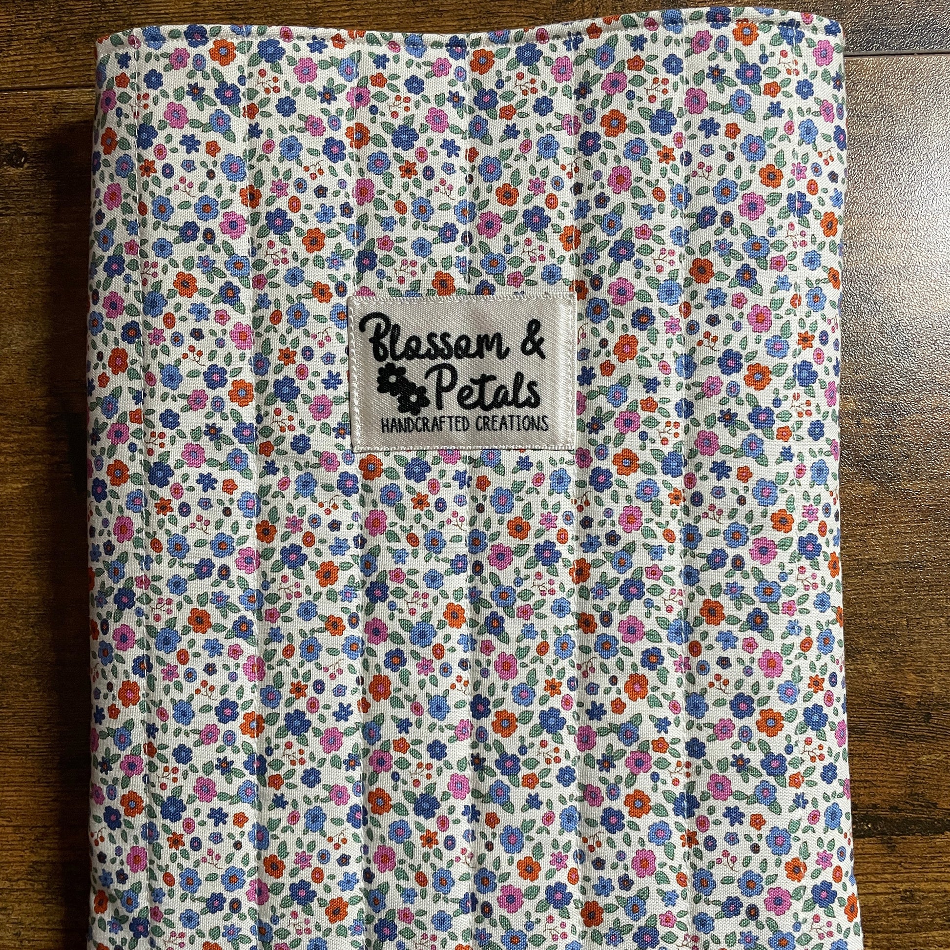Handmade cream floral padded fabric book sleeve for protecting books, journals, and planners