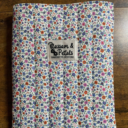 Handmade cream floral padded fabric book sleeve for protecting books, journals, and planners