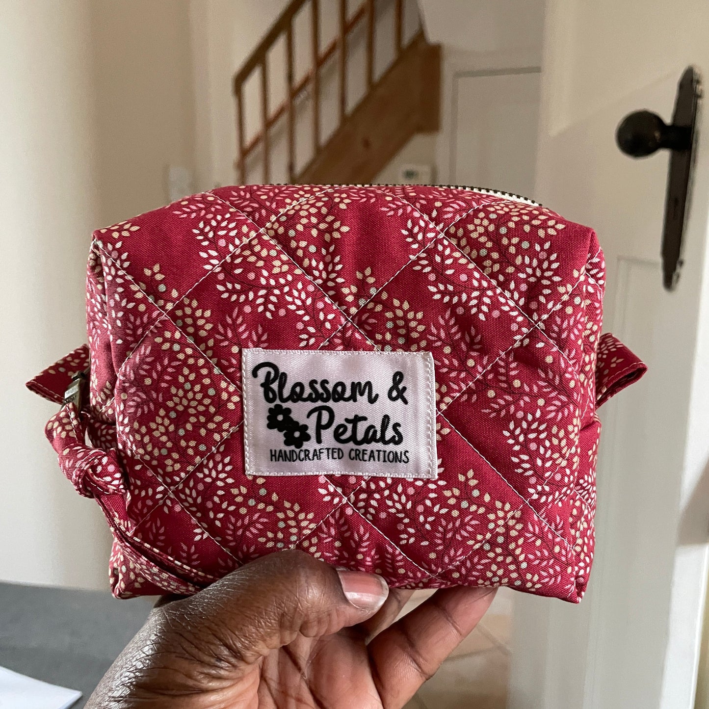 Handmade quilted floral makeup bag with zip closure, padded cotton cosmetic pouch ideal for travel and everyday use