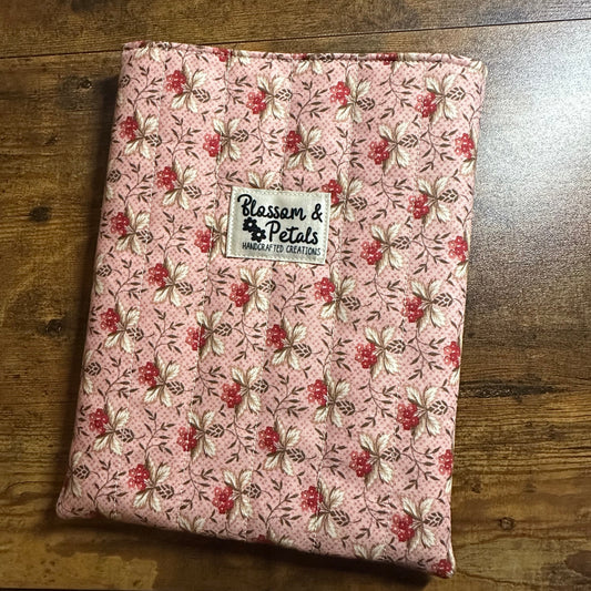 Quilted pink book sleeve with Blossom & Petals label, lined interior