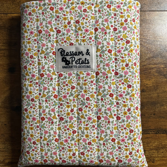 Handmade small floral padded fabric book sleeve protecting books and journals
