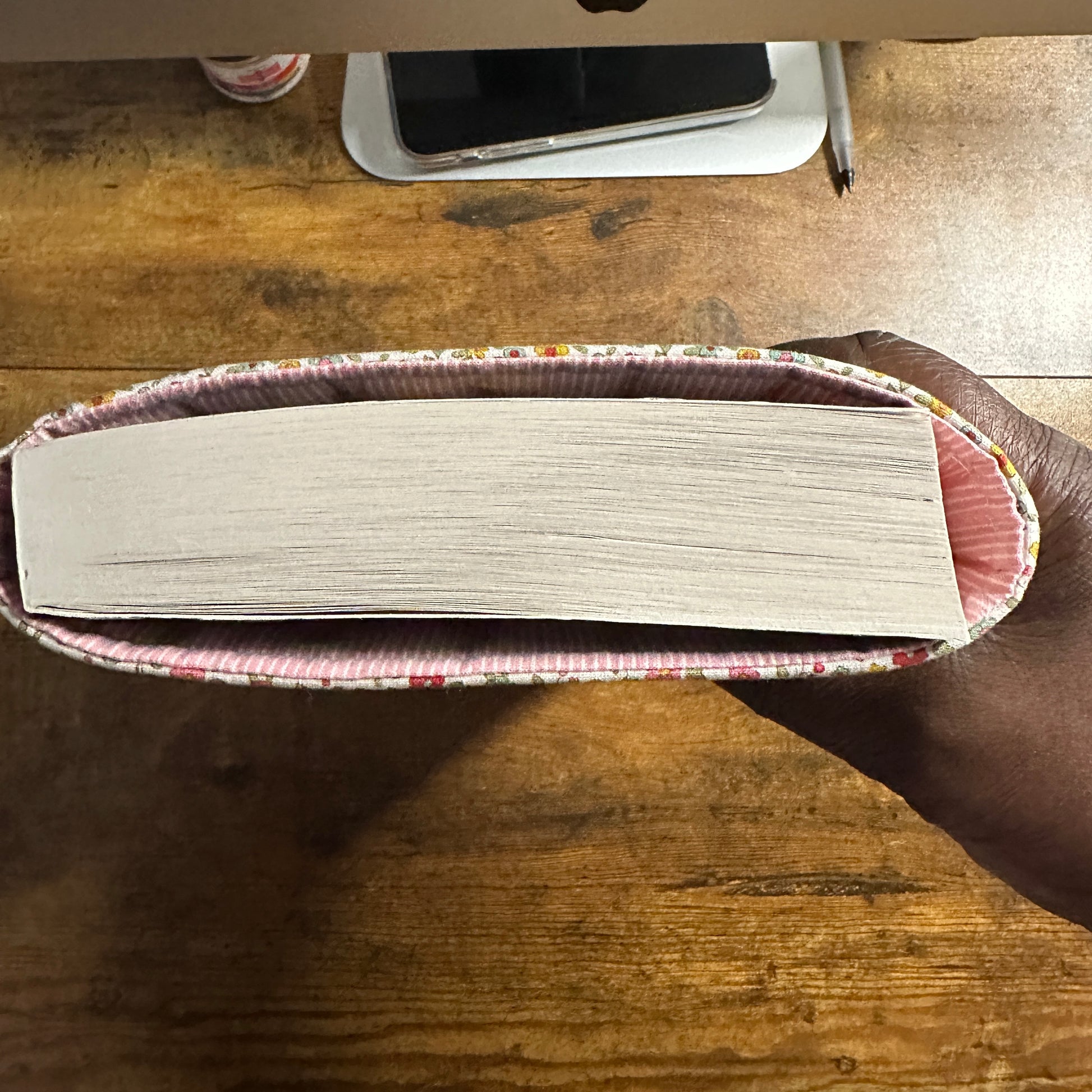 Handmade small floral padded fabric book sleeve protecting books and journals