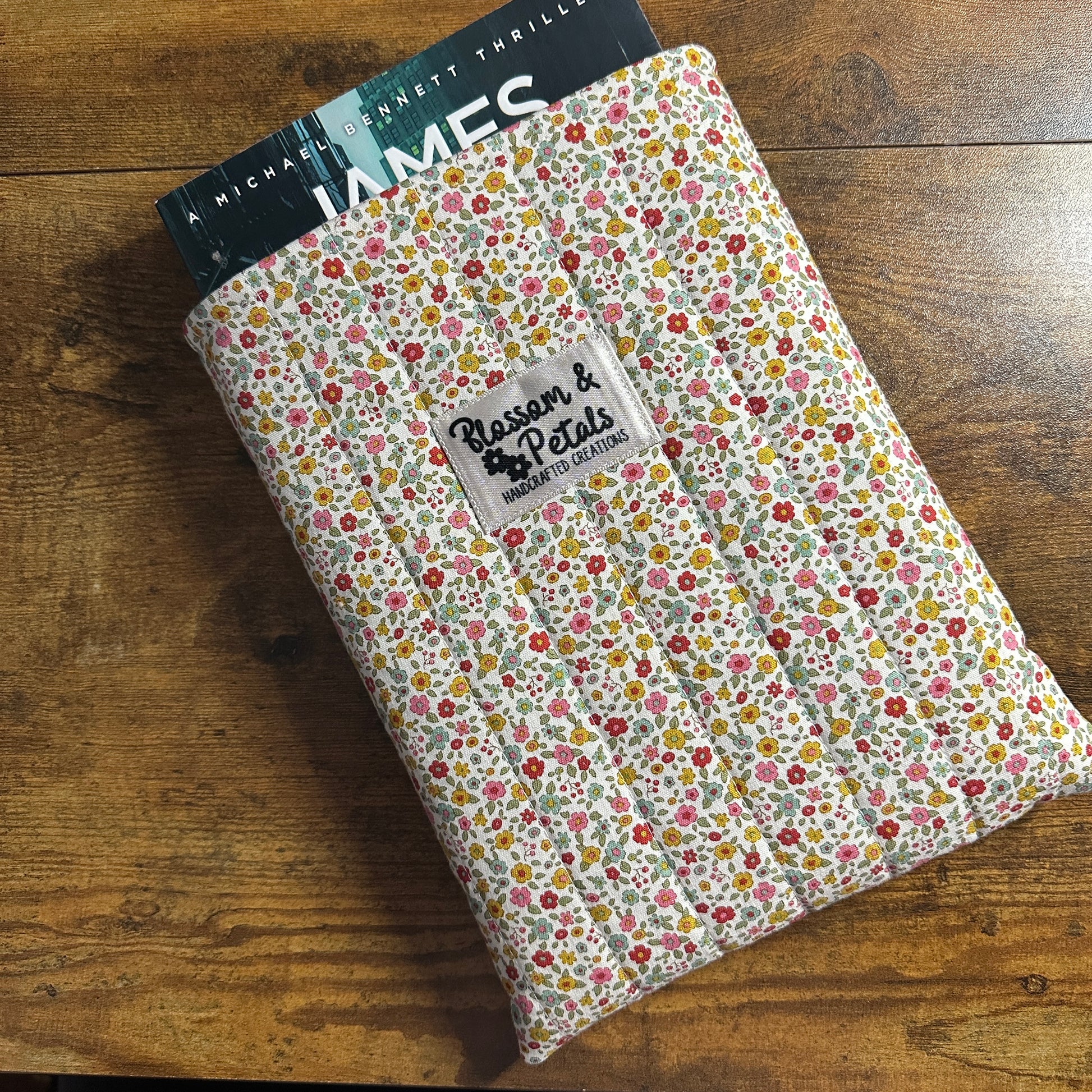 Handmade small floral padded fabric book sleeve protecting books and journals